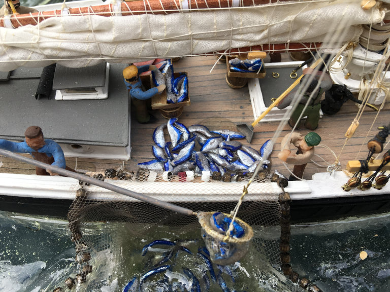 dipping the mackerel onto deck