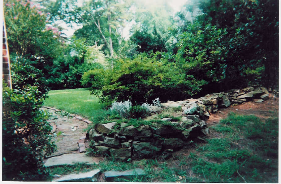 stone wall at front of house
